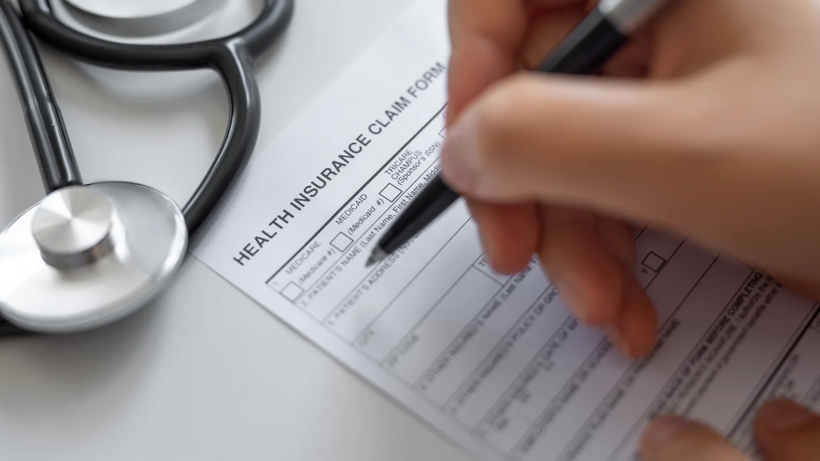 Health insurance claim form being completed for teen treatment verification