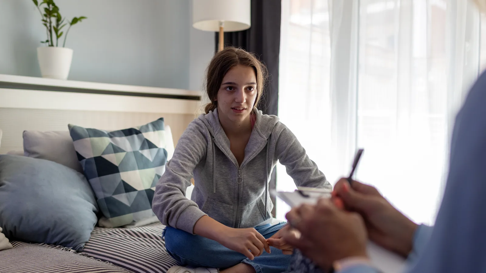 Teen girl in a therapy session for a parent guide about bulimia symptoms and purging risk