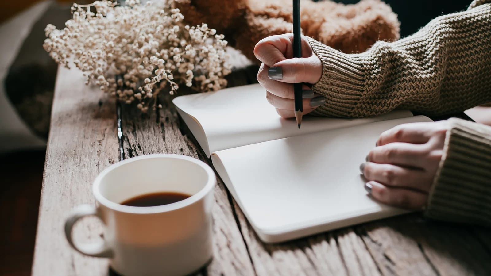 Open journal and pen for a teen grief support plan after loss