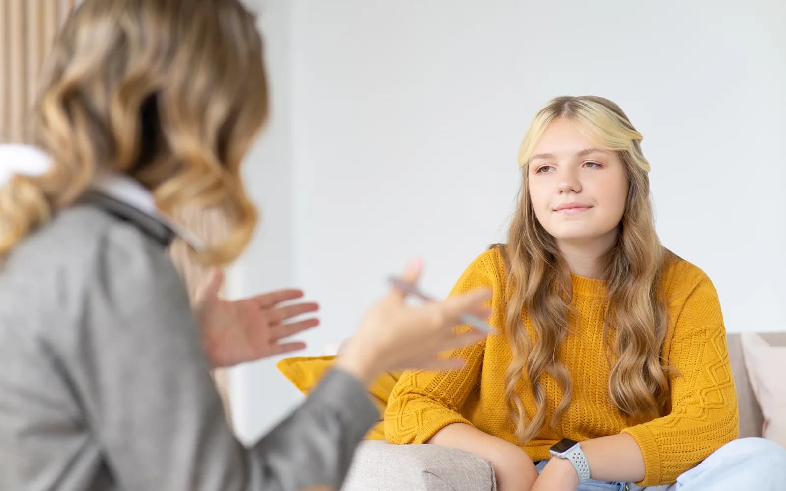 Teen and therapist in a trauma-focused therapy session.